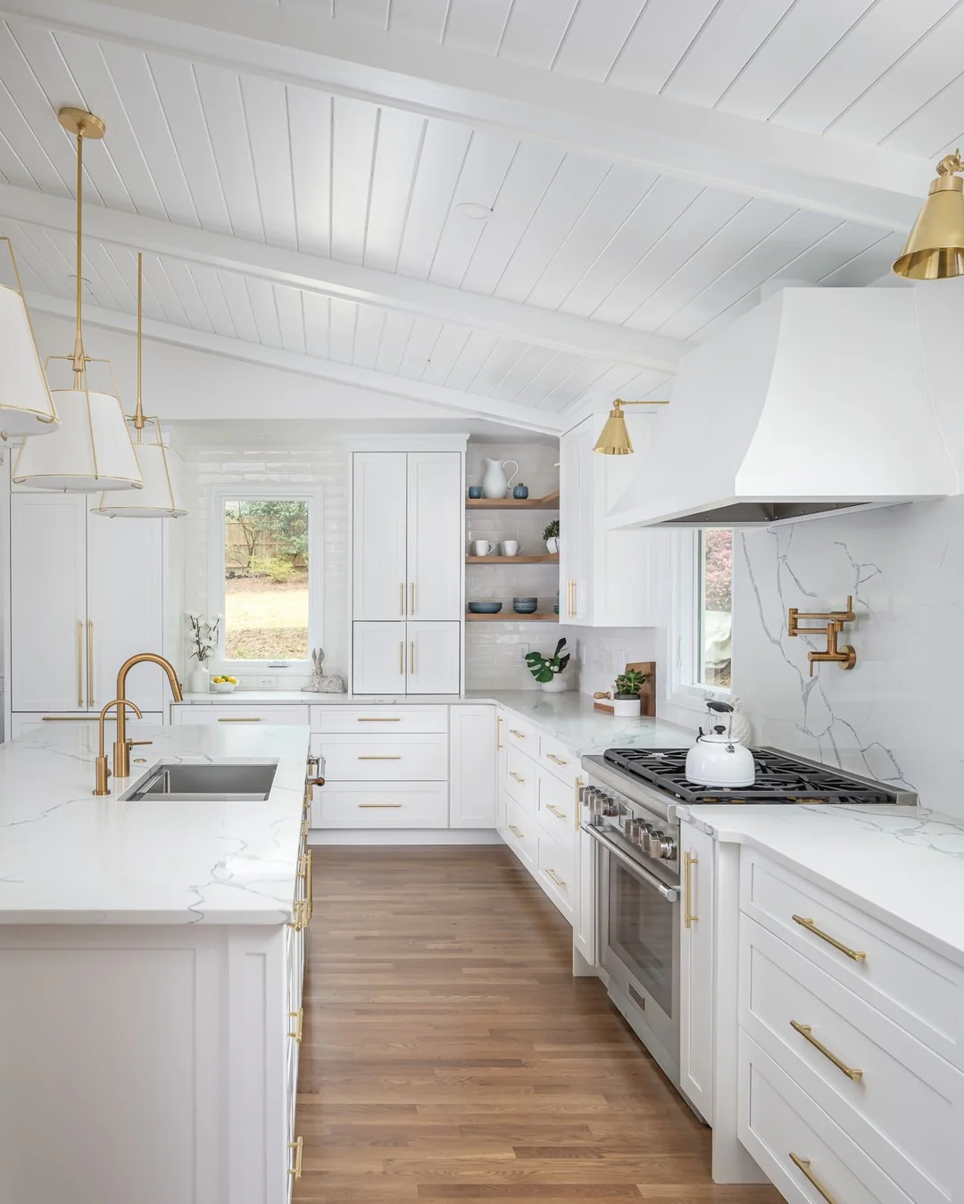Marble-Look Backsplash With Brass Pot Filler